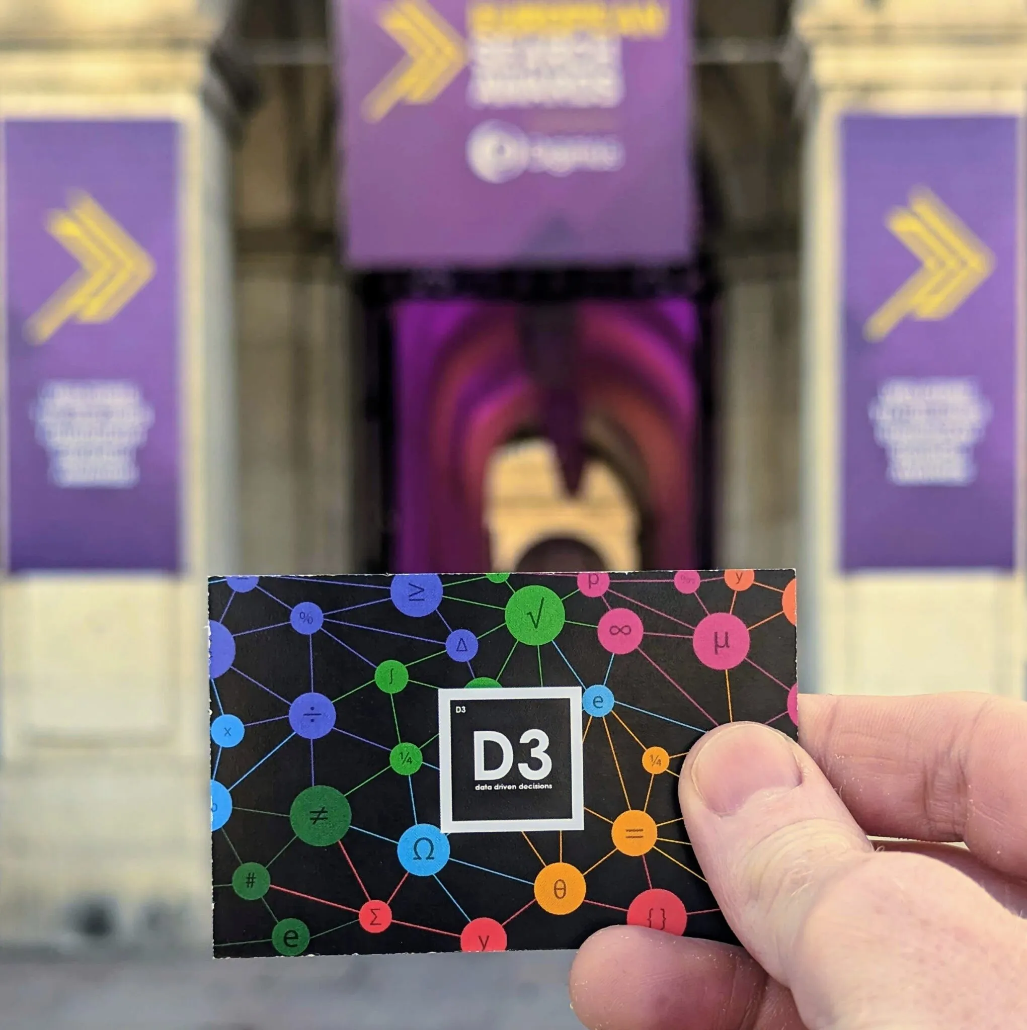 A D3 business card held up outside the European Search Awards venue in Lisbon